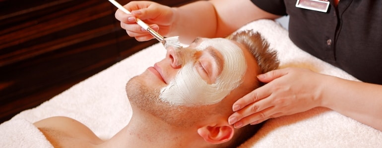 Men gets a facial treatment